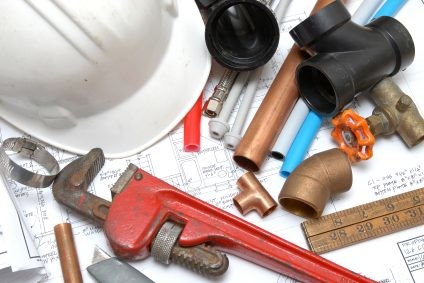 Plumbing parts, tools, and plans used by Central Florida Plumbing and Piping LLC.